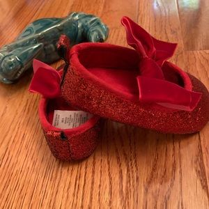 NWOT RED GLITTER FLATS WITH RED VELVET BOW.